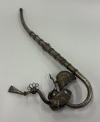 An Oriental silver pipe.