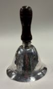 A large modernistic silver table bell.
