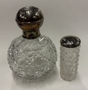 A large silver-lidded glass perfume bottle etc.