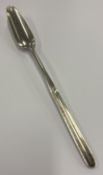 A George III silver marrow scoop.