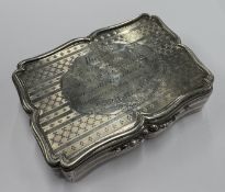 A large and oversized silver snuff box.
