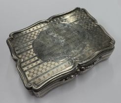 A large and oversized silver snuff box.