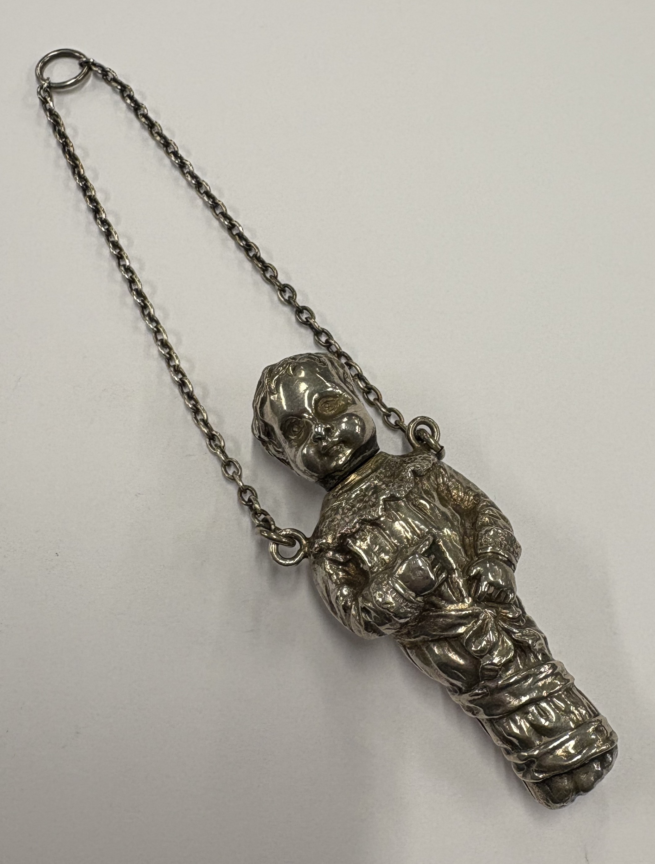 A silver scent bottle.