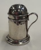 A Victorian silver kitchen pepper.