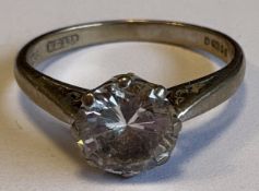 A single-stone diamond ring.