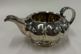 A fluted George IV silver cream jug.