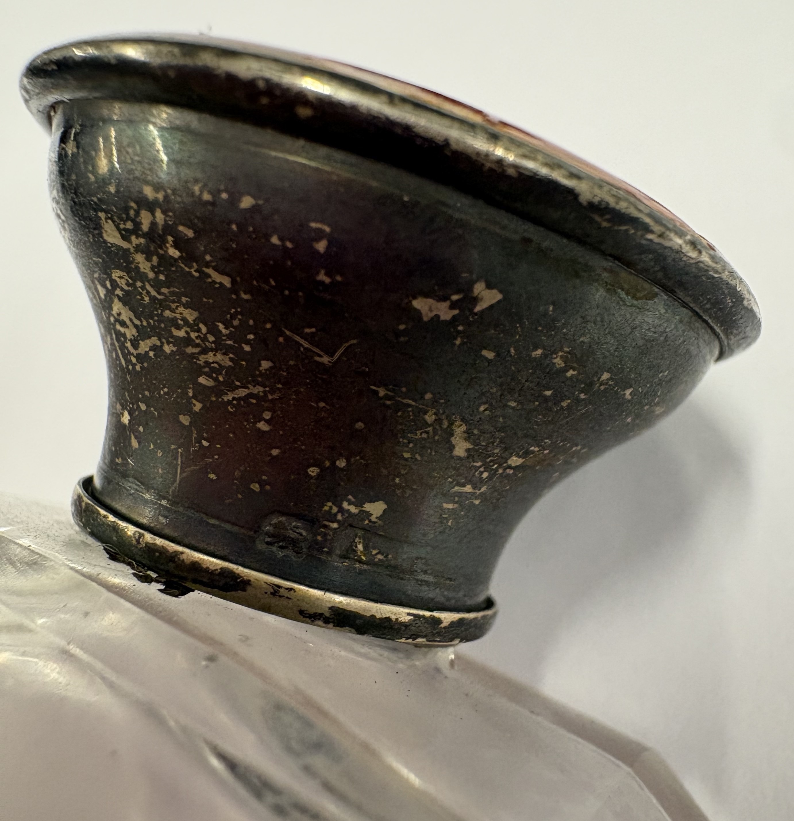 An early 20th Century silver and red enamelled glass scent bottle. - Image 2 of 3