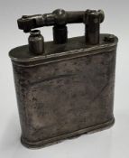 A silver Dunhill lighter.