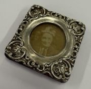 A chased silver frame.