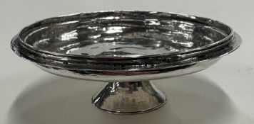 A 17th Century Queen Anne silver paten.