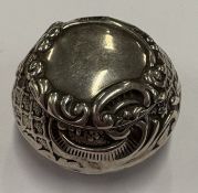 An Art Nouveau silver pill box.