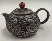 A Chinese metal teapot.
