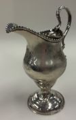 An 18th Century George III silver cream jug.