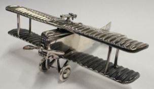 A Continental silver model of an aeroplane.