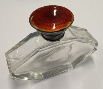 An early 20th Century silver and red enamelled glass scent bottle.