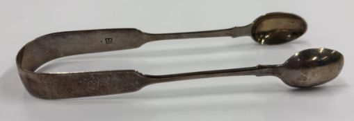 EXETER: A pair of silver sugar tongs.