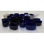 A selection of various blue glass liners and inkwell liners.