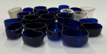 A selection of various blue glass liners and inkwell liners.
