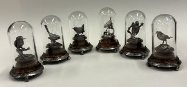 A set of six silver figures of birds.