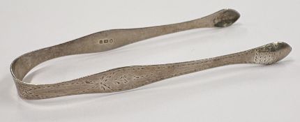 A pair of silver sugar tongs.