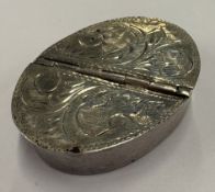 A double-opening silver pill box.
