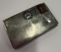 An American silver and enamelled stamp holder.