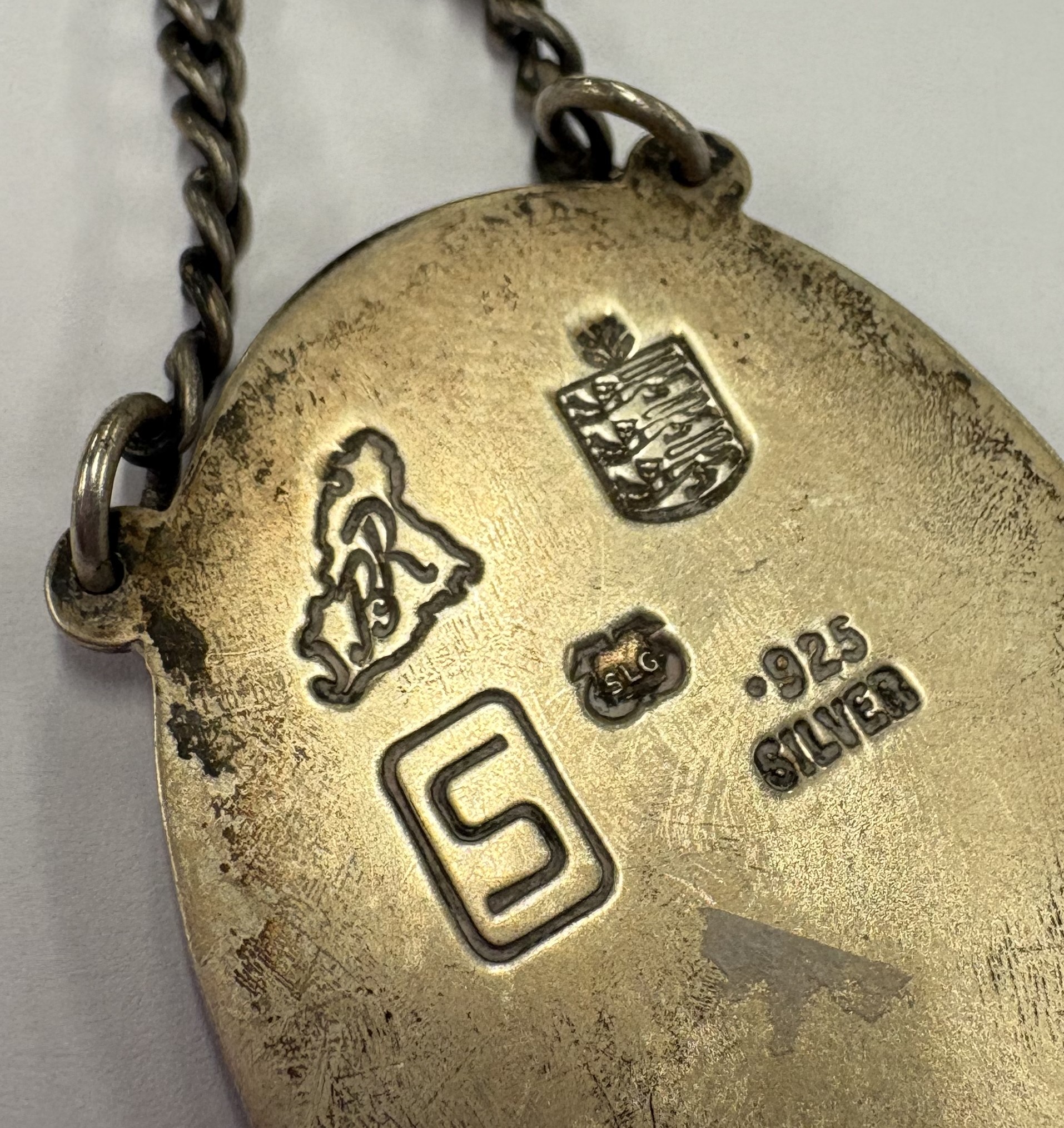 A Channel Islands silver and enamelled label. - Image 2 of 2