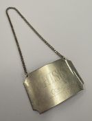 A Concorde silver decanter label for 'Whisky'.
