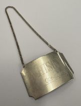 A Concorde silver decanter label for 'Whisky'.