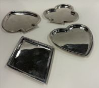 A rare set of four silver 'bridge/playing card' dishes.