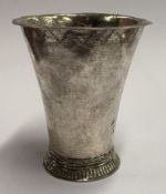 An 18th Century silver beaker.