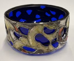 A pierced silver and enamelled salt.