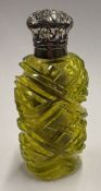 A Victorian silver-mounted yellow glass scent bottle.