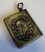 An unusual silver stamp case.