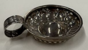 A Continental silver wine taster.