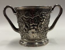 A rare two-handled chased silver cup.
