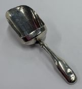 A George III silver caddy spoon.