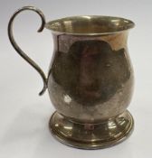 A silver toy tankard.