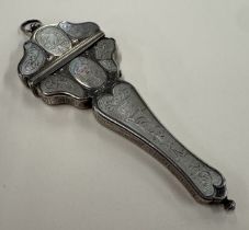 A silver and MOP scissor case.