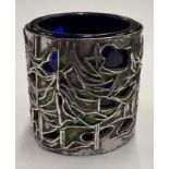 A pierced silver and enamelled salt.
