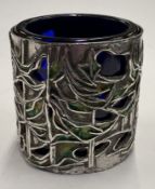 A pierced silver and enamelled salt.
