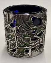 A pierced silver and enamelled salt.