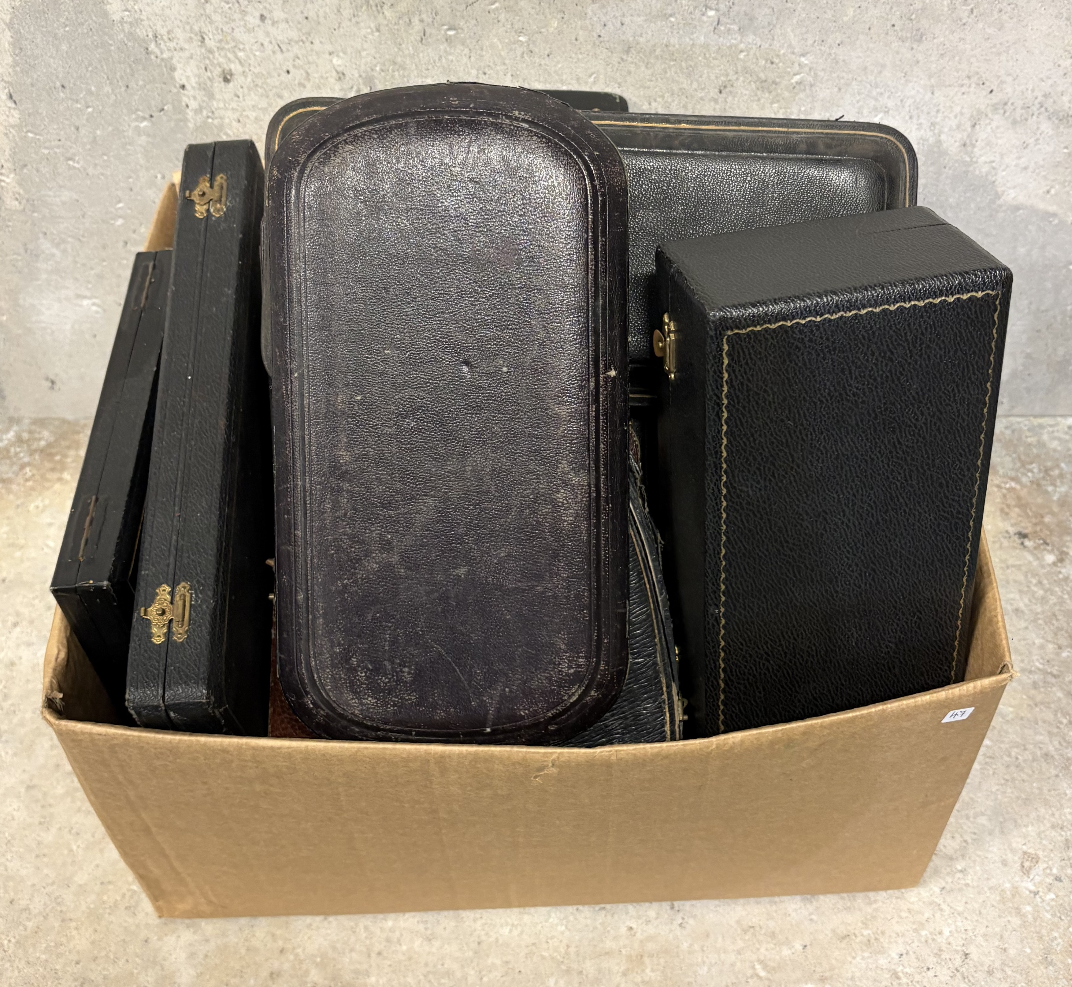 A box containing various cases and boxes.