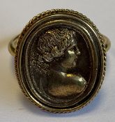 A high carat gold signet ring.