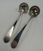 EDINBURGH: A pair of George III Scottish silver toddy ladles.