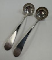 EDINBURGH: A pair of George III Scottish silver toddy ladles.