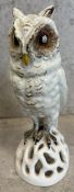 A ceramic figure of a snowy owl.