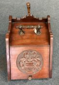 An Edwardian mahogany coal box.