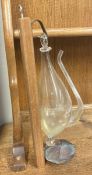 A wooden-mounted hand blown weather glass.