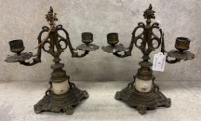 A pair of French gilt metal candelabra.